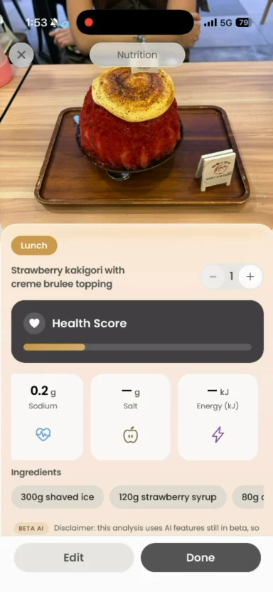 The nutrition detail screen: a photographed meal identified as strawberry kakigori with creme brulee topping, a health score, and a per-ingredient sodium, salt and energy breakdown.