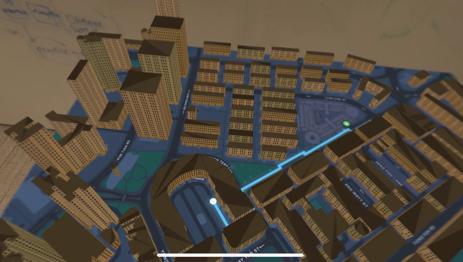 The full tabletop miniature: extruded shophouses and tower blocks, road ribbons and greenery from a real OpenStreetMap extract of Tiong Bahru, with the route animating along the streets from the green start pin to the home marker.